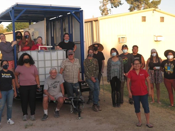 Indige-FEWSS trainees posing for photo alongside water solution equipment