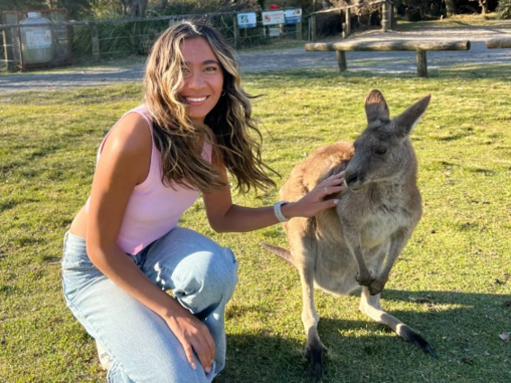Angelina Terlizzi petting a kangaroo