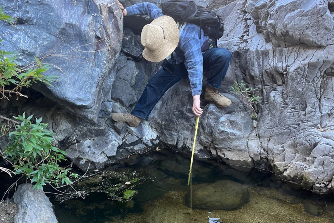 Oskar Anderson samples pond