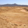 A dry, dusty desert landscape.