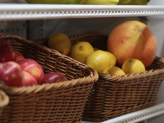 Two wicker baskets filled with fresh fruits