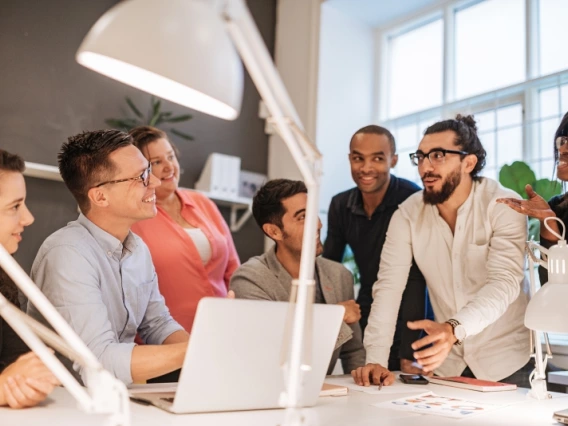 A group of people discussing a design together