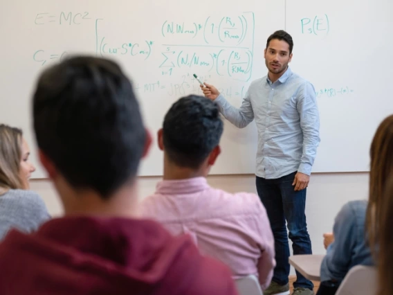 Physics teacher giving a lecture to students