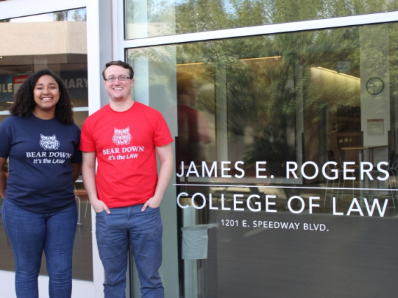 Students stand outside James E. Rogers College of Law building