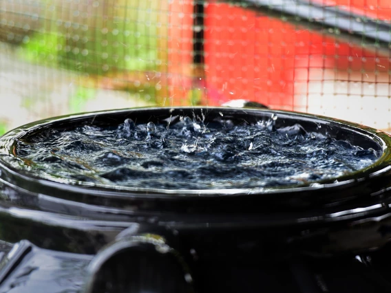 Water falling into a plastic bin.