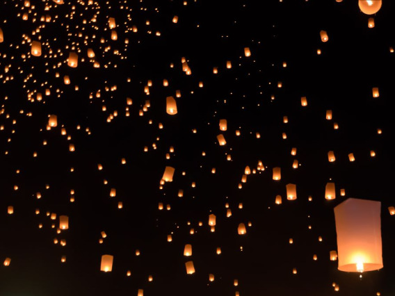 Paper lanterns in the night sky
