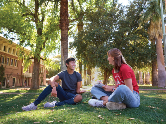 Students studying on the grass outside Douglass.