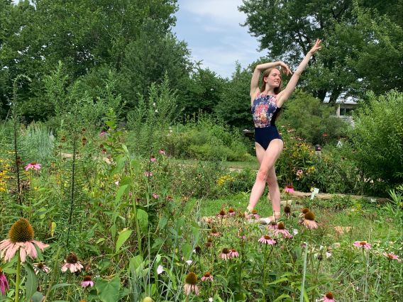 Katie Sweet dancing in a field of flowers