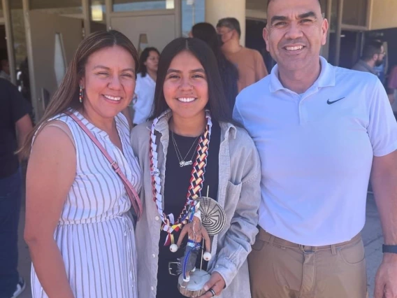 Bianca Rodriguez posting with an award