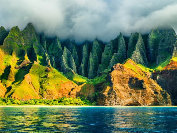 Na Pali coast, Kauai, Hawaii view from sea sunset cruise tour. Nature coastline landscape in Kauai island, Hawaii, USA.