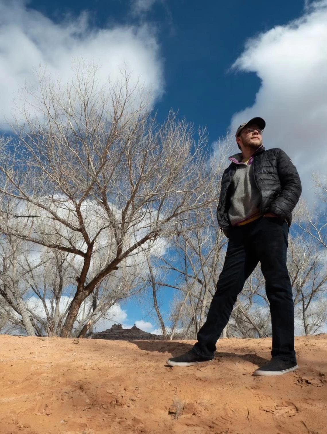 Alex Floyd standing near desert foliage