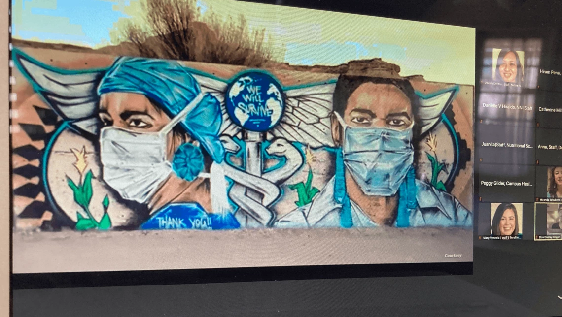 Graffiti art of a doctor and nurse with a medical logo and the phrase "We Will Survive"