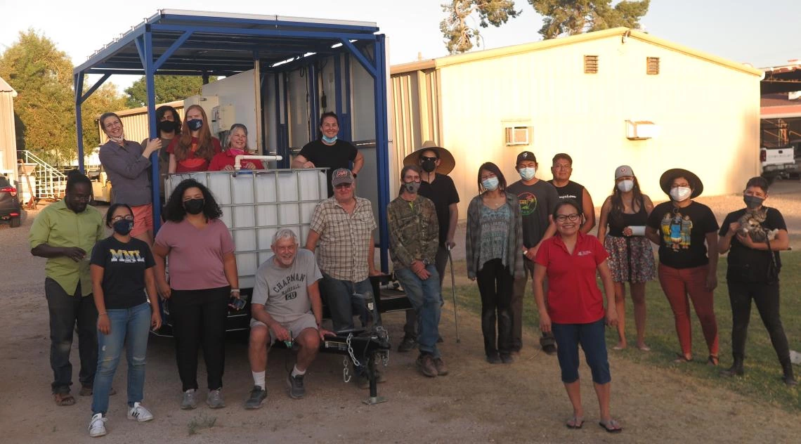 Indige-FEWSS trainees posing for photo alongside water solution equipment