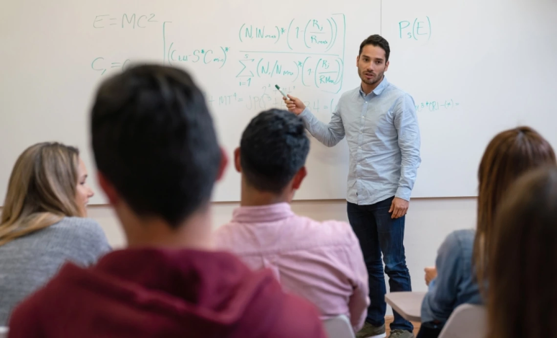 Physics teacher giving a lecture to students