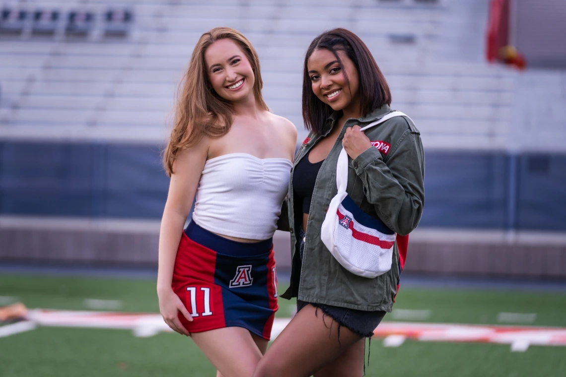 University of Arizona students model clothing and accessories from REPLAY Arizona, a vintage fashion line