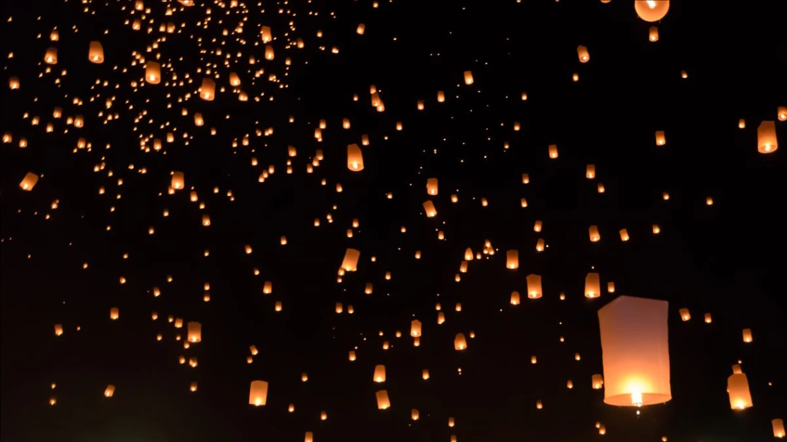 Paper lanterns in the night sky