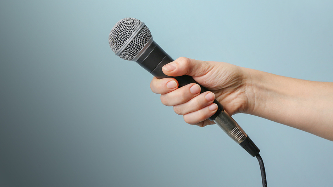 Person holding a microphone