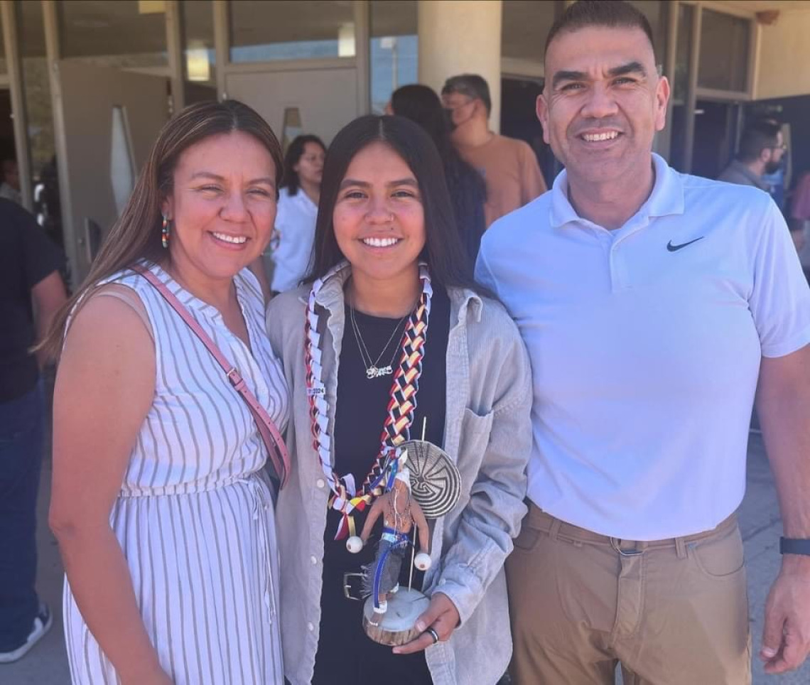 Bianca Rodriguez posting with an award