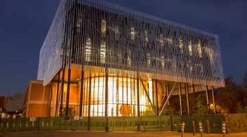 View of the Tree Ring Laboratory in the early evening with lights shining through