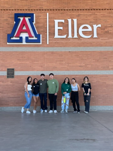 Students in front of Eller sign