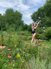 Katie Sweet dancing in a field of flowers